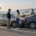 Multiple injured claimants car accident insurance limits in California, represented by a calm roadside scene in San Diego